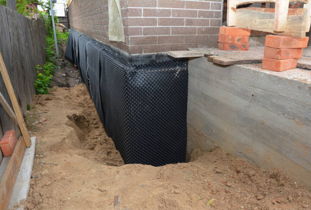 Happy homeowners after waterproofing job in Plover